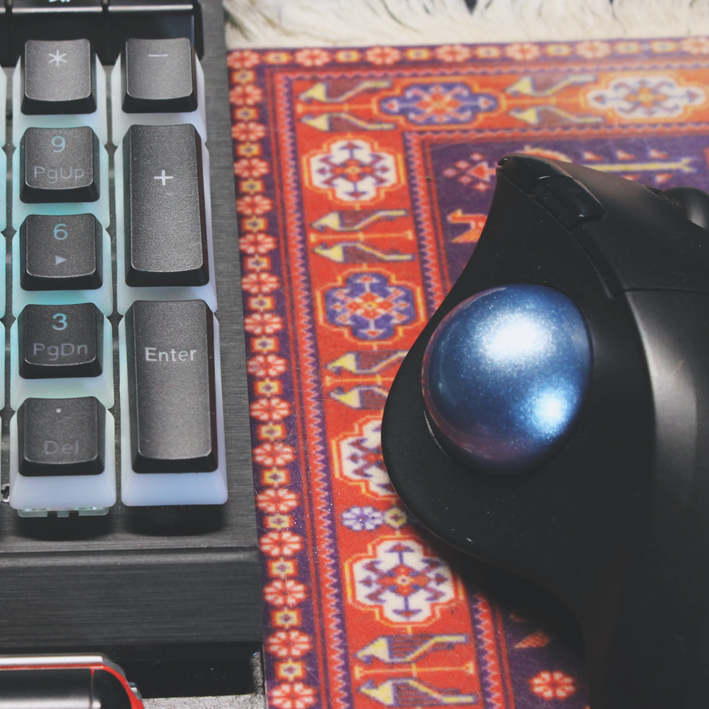 Close up of a computer keyboard and mouse.